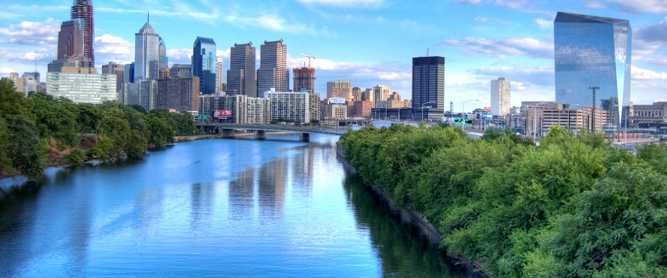 The Schuylkill River looking south toward the Philadelphia skyline, photographed by Ed Yakovich, at https://commons.wikimedia.org/wiki/File:Philadelphia_skyline_August_2007.jpg. 